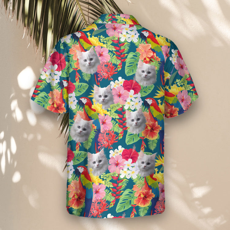 Bright custom Hawaiian shirts with faces on them, featuring macaws and hibiscus on a blue background, ideal for creating a standout look at tropical gatherings.