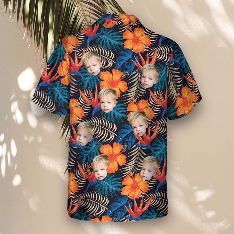 Tropical custom Hawaiian shirts featuring bright hibiscus and lush palm leaves. Personalize shirts with faces on them for a fun, stylish touch.