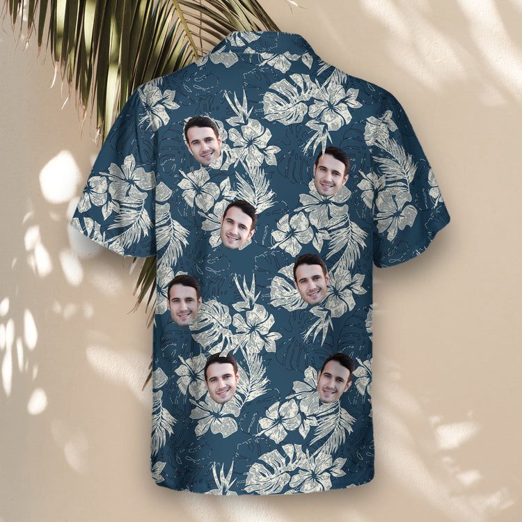 Vintage-inspired custom Hawaiian shirts with blue hibiscus flowers and tropical leaves. Add faces on them for a personalized, grunge-style tropical look.