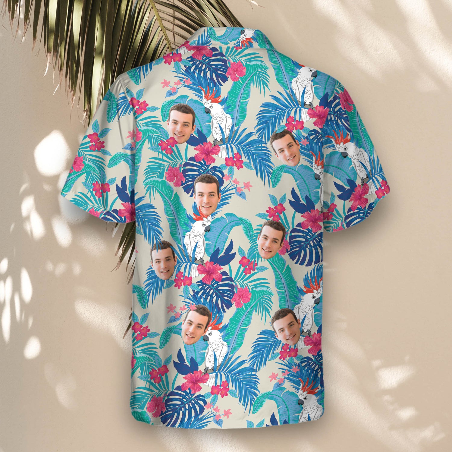 Lush tropical custom Hawaiian shirts with cockatoos, banana leaves, and hibiscus—stylish shirts with faces on them for vacations and beach days.