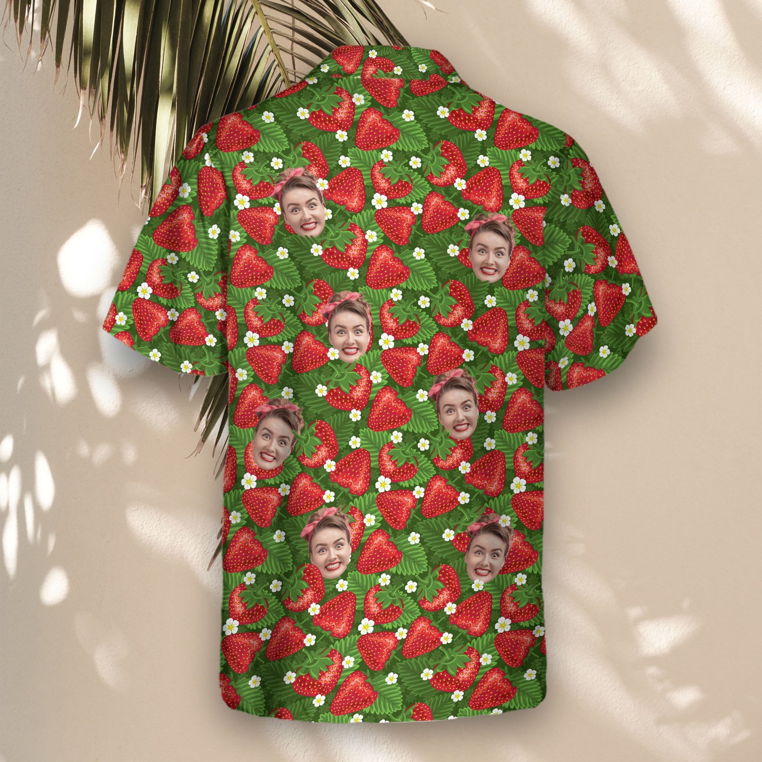 Vibrant custom Hawaiian shirts with faces on them, showcasing juicy strawberries, tropical leaves, and delicate blossoms for a stylish, fruity island feel.