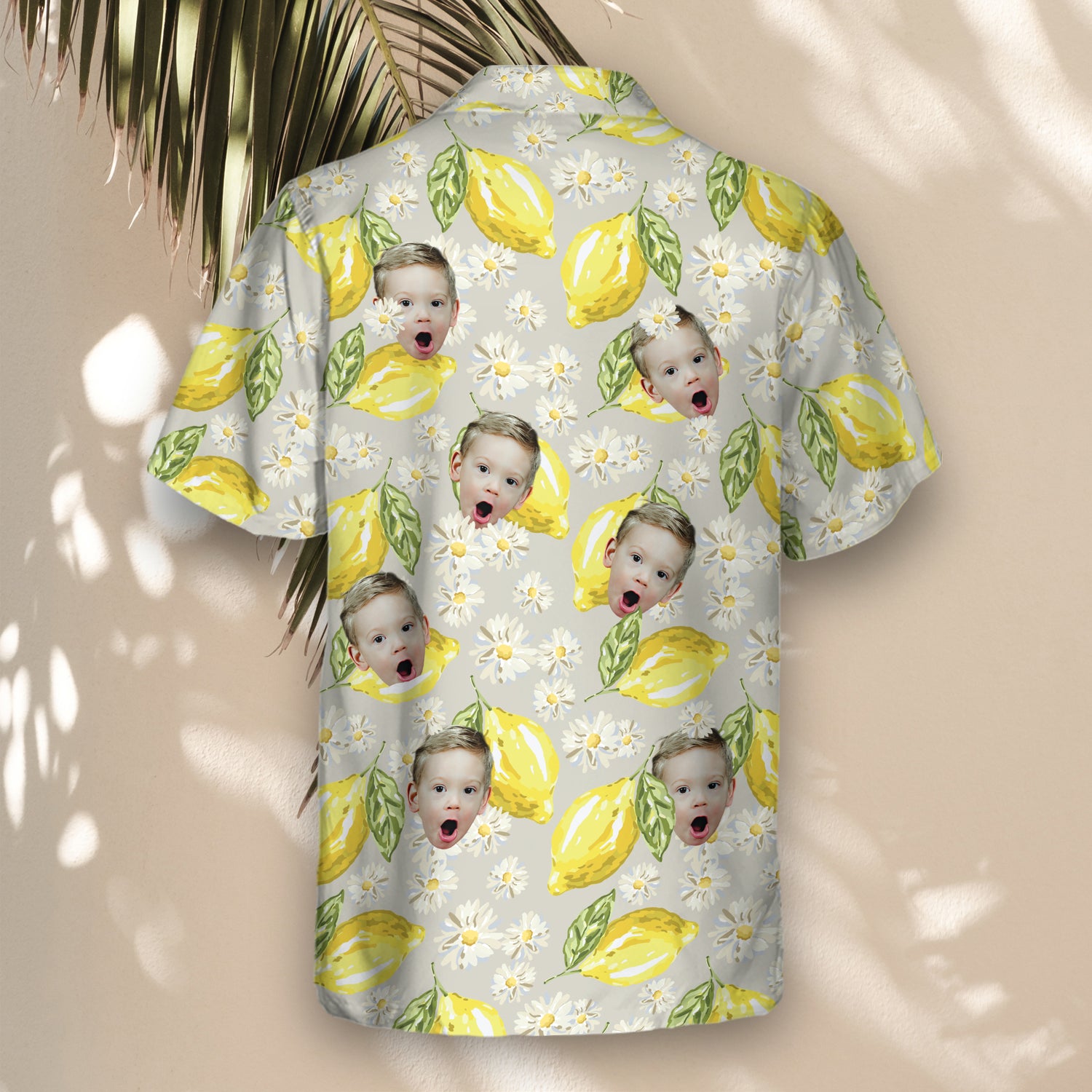 Custom Hawaiian shirts with faces on them, showcasing lemons, daisies, and green leaves on gray, perfect for a fresh, stylish look at any event.