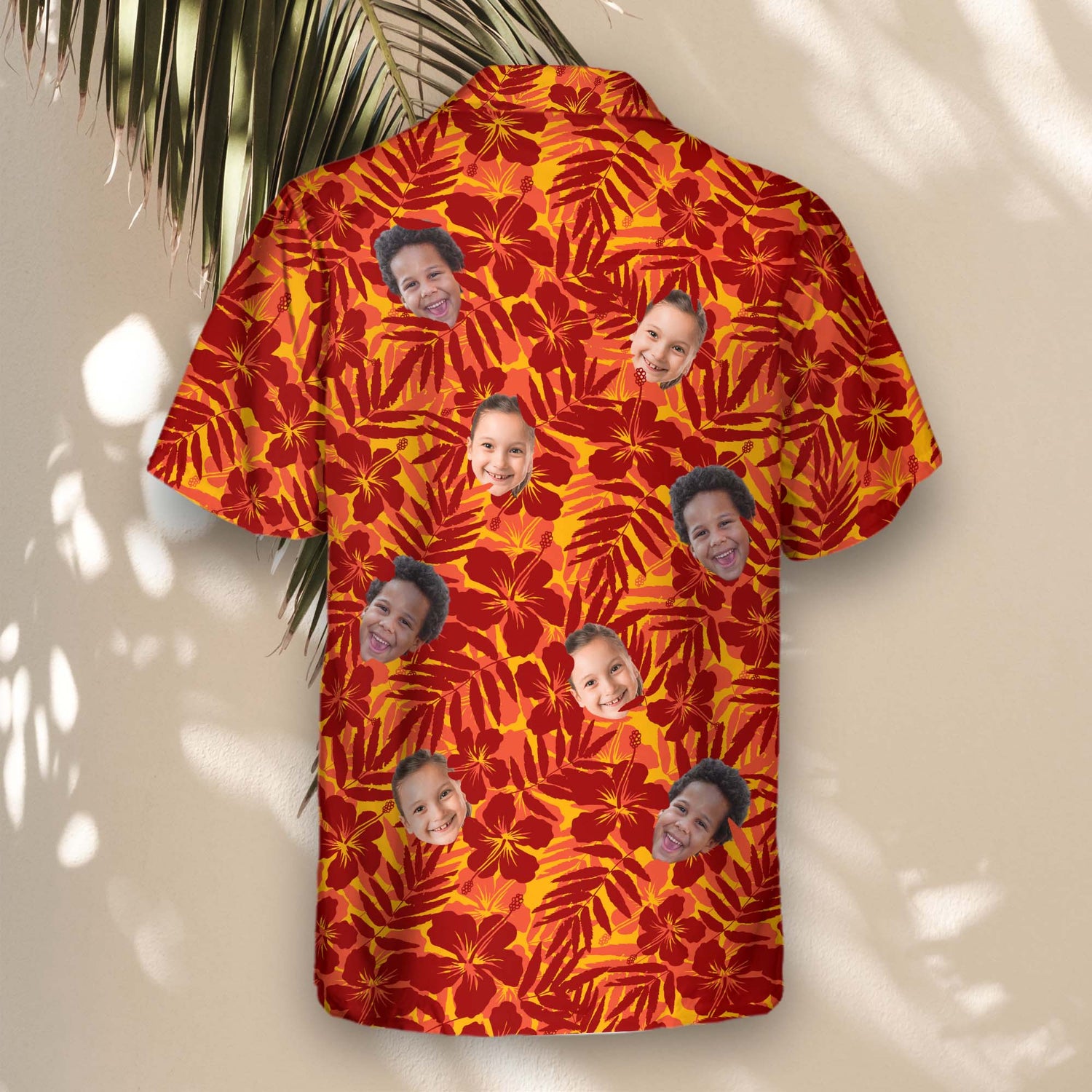 Vibrant custom Hawaiian shirts with faces on them, designed with bold red and orange tropical flower silhouettes, lush palm leaves, and exotic island vibes.