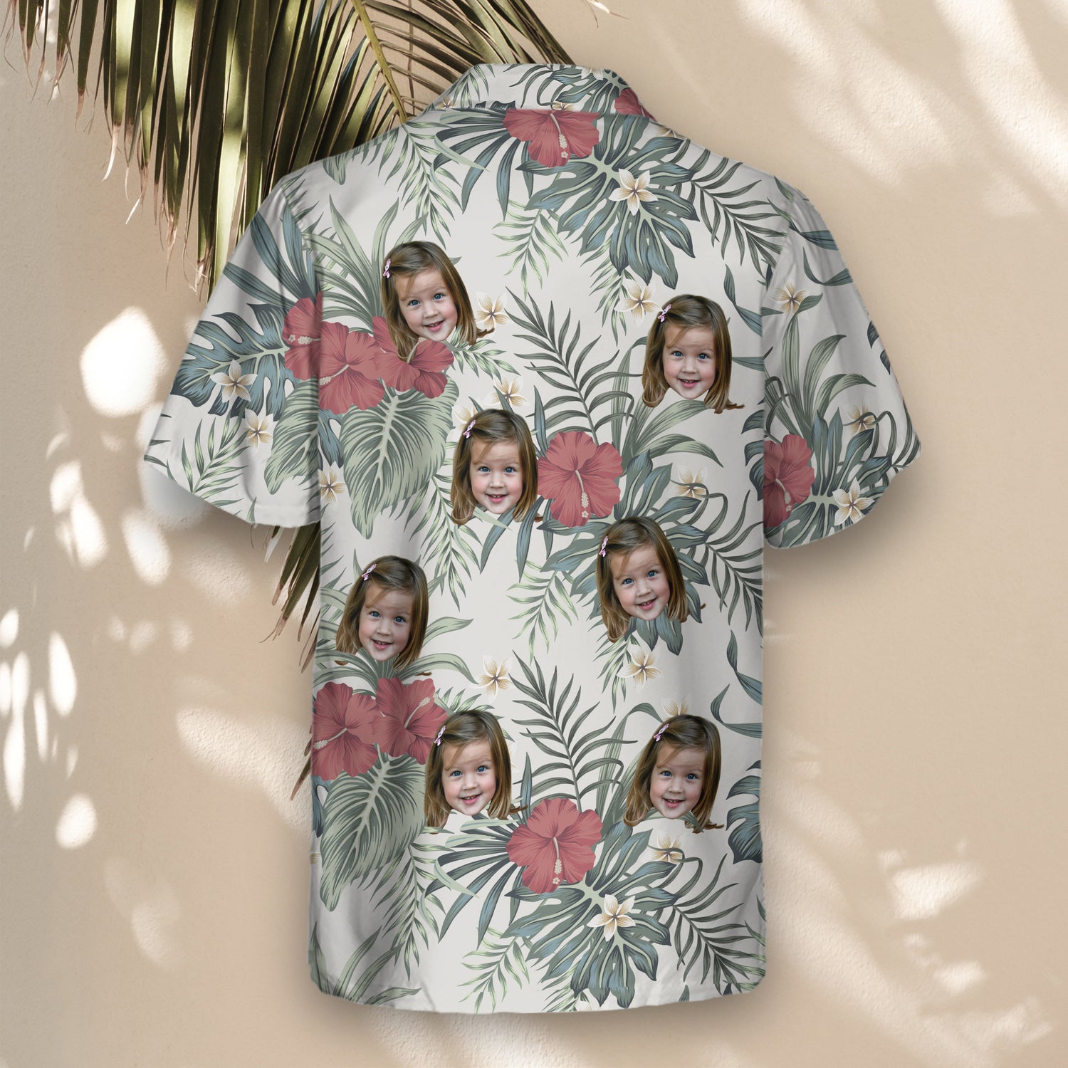 Vintage-inspired custom Hawaiian shirts with hibiscus and plumeria on a grey background. Add faces on them for a fun, retro tropical style.