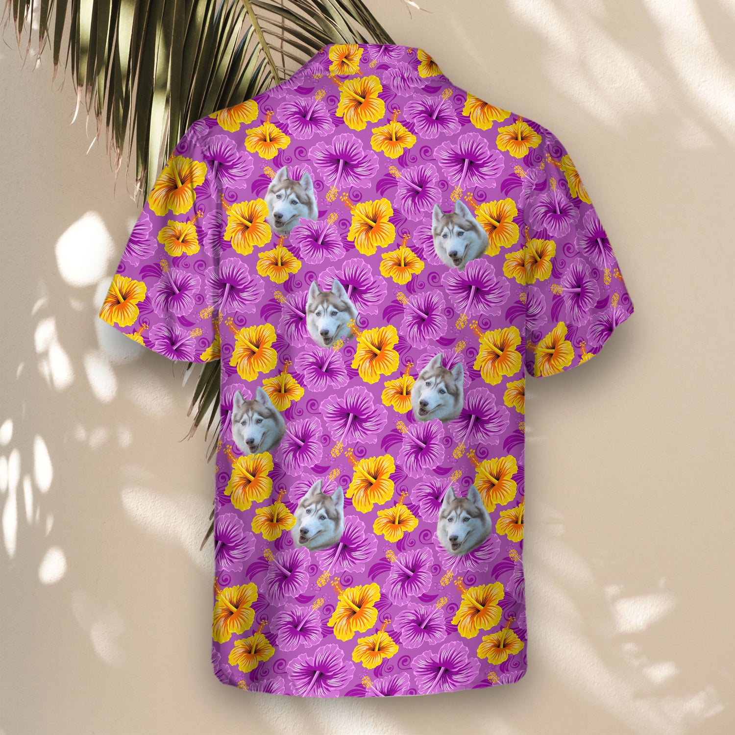 Swirling floral Hawaiian shirts with faces on them, blending purple and yellow hibiscus in a tropical design.