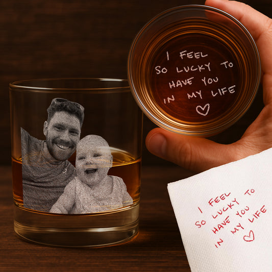 Premium custom whiskey glass with clear engraving of a photo and handwritten note, placed on a dark wood table, ideal for Father’s Day or anniversary gift photography.